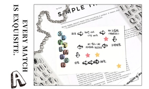 DIY transparent alphabet stamp set spelling SEPTEMBER on card with acrylic block