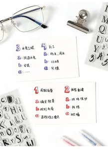 Detailed set of clear letter and number stamps with markers for creative journaling