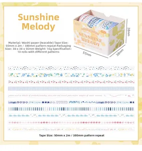 Macro detail of the Sunlight Melody washi tape set with floral and grid patterns