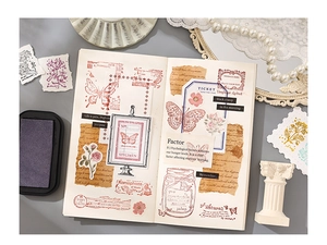Detail showing vintage butterfly and rose stickers in an aesthetic planner layout