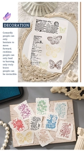 Detailed view of vintage aesthetic scrapbook papers featuring butterflies and floral sketches