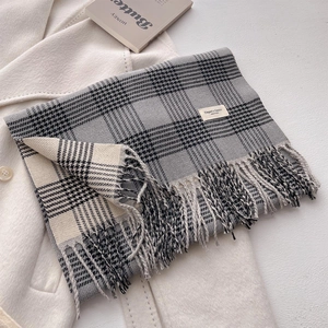 British style checkered scarf in grey and beige with soft fringe on wool coat