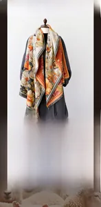 Detailed texture of thick imitation cashmere shawl with vintage floral and butterfly patterns