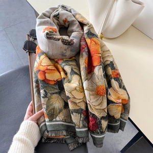 Elegant floral print shawl with fringe detail in vintage aesthetic for winter warmth