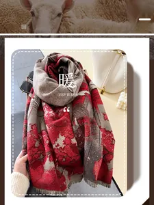 Detailed close-up of thick red floral wool scarf featuring rich texture and fringe edges
