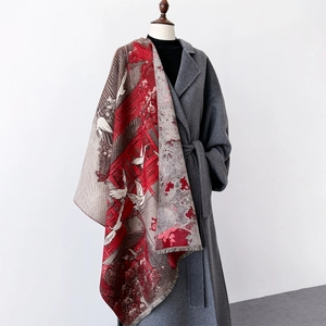 Thick red and grey Chinese style shawl with crane patterns and fringe on wool coat
