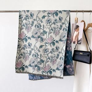 Detailed close-up of premium thick floral jacquard shawl with fringe and vintage patterns