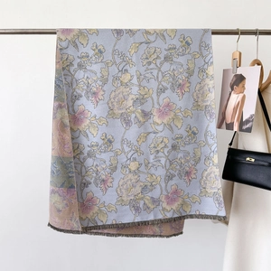 Elegant floral jacquard scarf in light blue and purple with fringe and retro style