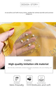 Detailed macro view of yellow-white silk scarf with pearl and rhinestone clover patterns