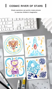 Cosmic River of Stars stencil set showing astronaut and rocket drawings on a desk
