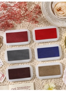 Detailed view of 6 retro ink pads in vintage colors for scrapbooking and DIY crafts
