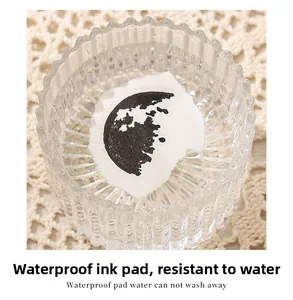 Waterproof ink pad detail showing lunar moon stamp underwater to demonstrate smudge-proof effect