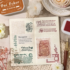 Vintage high density oil based ink pads with decorative stamps on a journal page