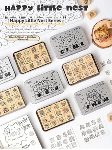 Detailed view of Happy Little Nest wooden rubber stamps in decorative metal storage tins