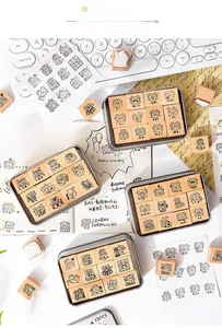 Detail view of wooden cartoon stamps set in metal boxes for DIY scrapbooking decoration