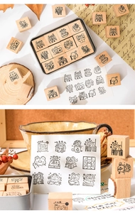 Macro detail of cartoon bear wooden stamp set in a metal storage box for DIY planners