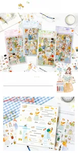 Close-up of Four Seasons themed decorative stickers applied to a personal journal
