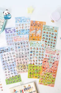 Close-up of cute cartoon PET stickers featuring pandas and rabbits on a desktop