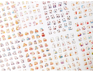 Close-up of cute watercolor PET stickers featuring cartoon animals and scrapbooking themes