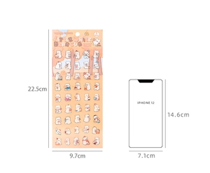 Size comparison of cute cartoon bear stickers next to an iPhone 12 for scale