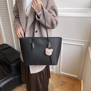 Vintage black woven texture tote bag for women with plush bear pendant and metal logo