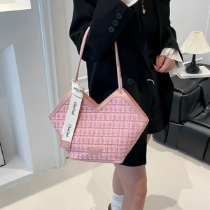 Pink tweed tote bag for women with woven texture and a stylish leather shoulder strap