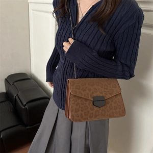 Vintage leopard print crossbody bag with gold chain strap and metal clasp for women