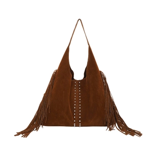Brown suede hobo shoulder bag with tassels and silver studs in a minimalist retro style