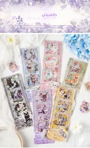 Detailed view of feline PET stickers with cats and floral patterns on white fabric
