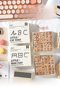 Close-up of 36pcs wooden stamps set with cute bear and cat fonts for DIY scrapbooking