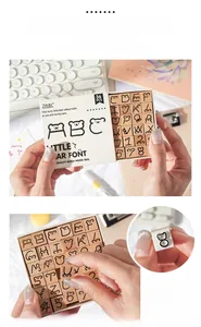 Macro detail of wooden alphabet stamps with cute bear font and durable rubber surface