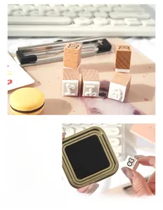 Detail of bear wooden stamps set and ink pad on a desk with natural office aesthetics