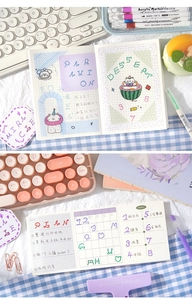 Detailed close-up of cute cartoon weekly planner with cat illustrations and grid layouts