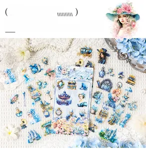 Macro shot of vintage PET stickers featuring blue castles, clocks, and elegant illustrations