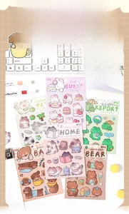 Detail of 3D resin animal stickers featuring cats and dogs for DIY phone cases and journals