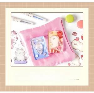 Detail shot of cute DIY stickers, acrylic shakers, and pink storage pouch on a desk