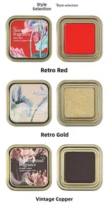 Vintage stamp ink pads in metal boxes featuring retro red, gold, and copper tones