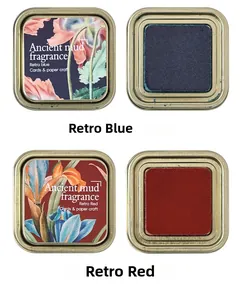 Detail of vintage blue and red ink pads in metal tins for cards and paper craft