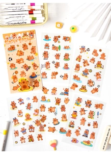 Detailed close-up of six sheets featuring cartoon bear sports and party themed stickers