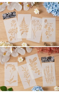 Vista dettagliata degli stencil PET con fiori e foglie per scrapbooking su legno