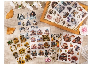 Macro shot of vintage scrapbooking stickers with diverse themes on beige linen cloth