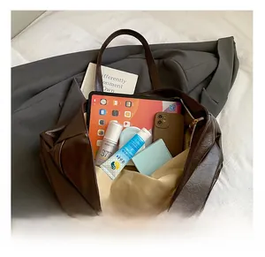 Top view of spacious brown leather tote bag showing large capacity for daily essentials