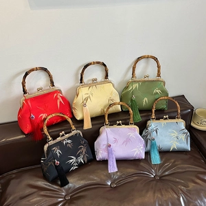 Elegant Chinese style qipao handbag with bamboo handle and silk tassel in various colors