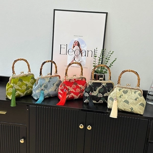 Elegant Chinese cheongsam bags with crane embroidery and vintage bamboo handles