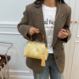 Elegant Chinese style handbag with bamboo handle and gold embroidery on satin fabric