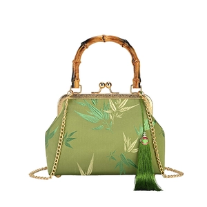 Elegant matcha green cheongsam handbag with bamboo handle, leaf embroidery and gold chain