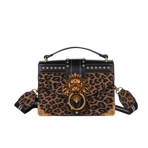 Leopard print crossbody handbag with golden lion head motif and metallic studs details