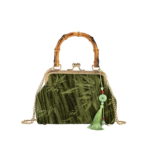 Retro dark green velvet handbag with bamboo handle and elegant bamboo leaf pattern