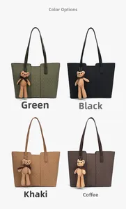 Detail view of large tote bags in four colors with V-pattern texture and bear charms