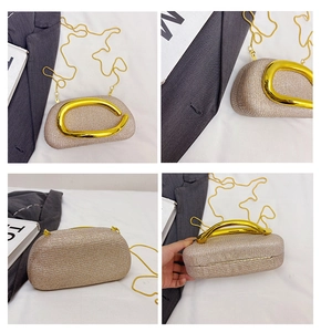 Macro shot of gold glitter fabric texture and polished metallic oval handle on evening bag